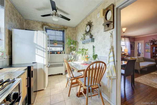 a dining room with furniture and window