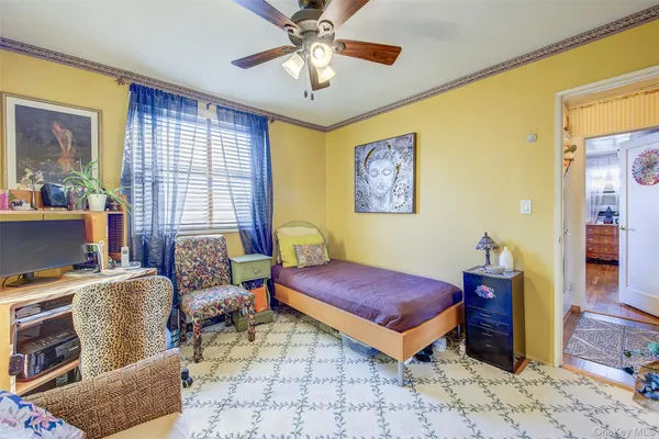 a bedroom with furniture and a chandelier