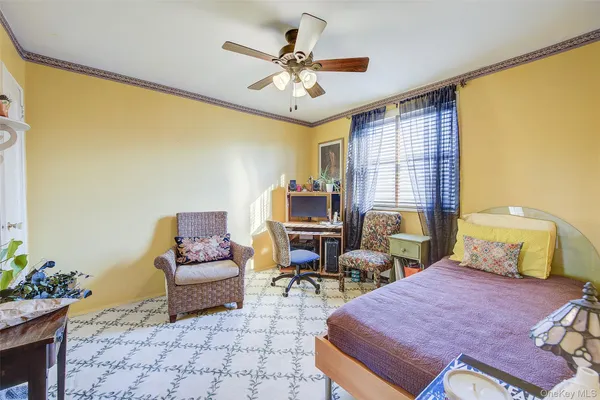 a bedroom with furniture and window
