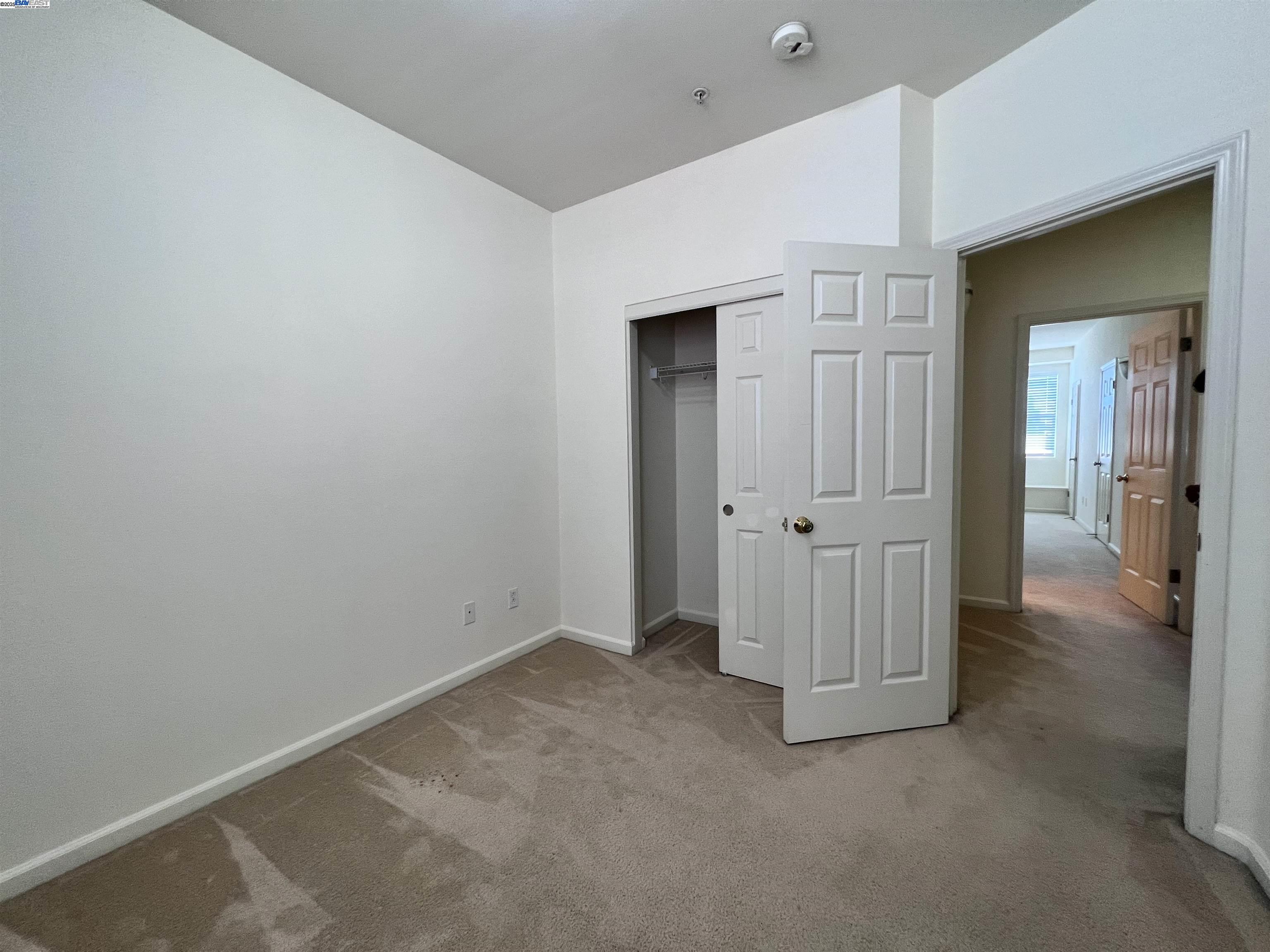 4331 Westerly Common Fremont, CA 94538 - Photo 17 of 24 an empty room with a door