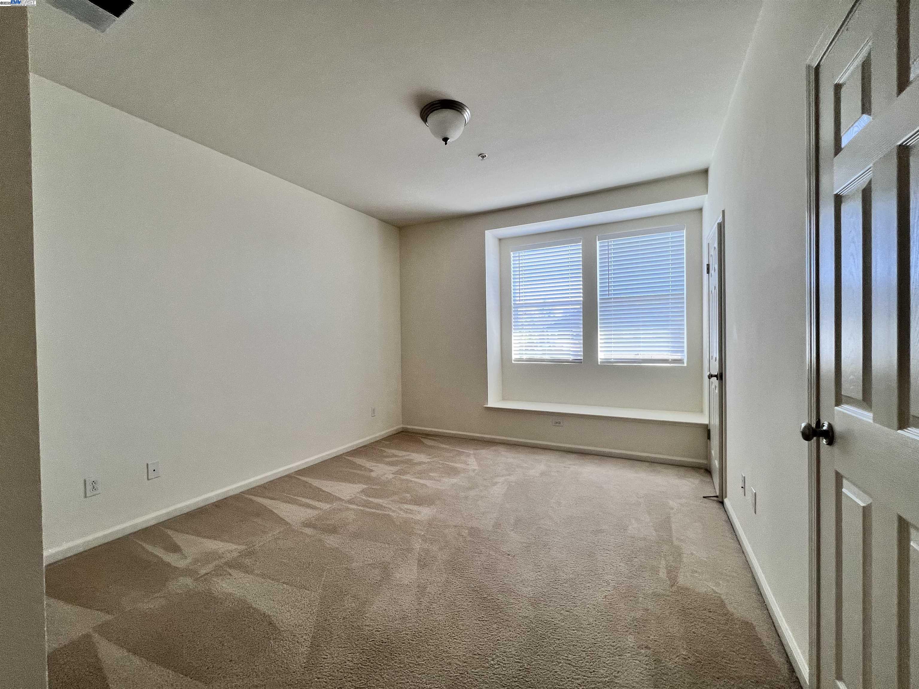 4331 Westerly Common Fremont, CA 94538 - Photo 18 of 24 a view of an empty room with a window