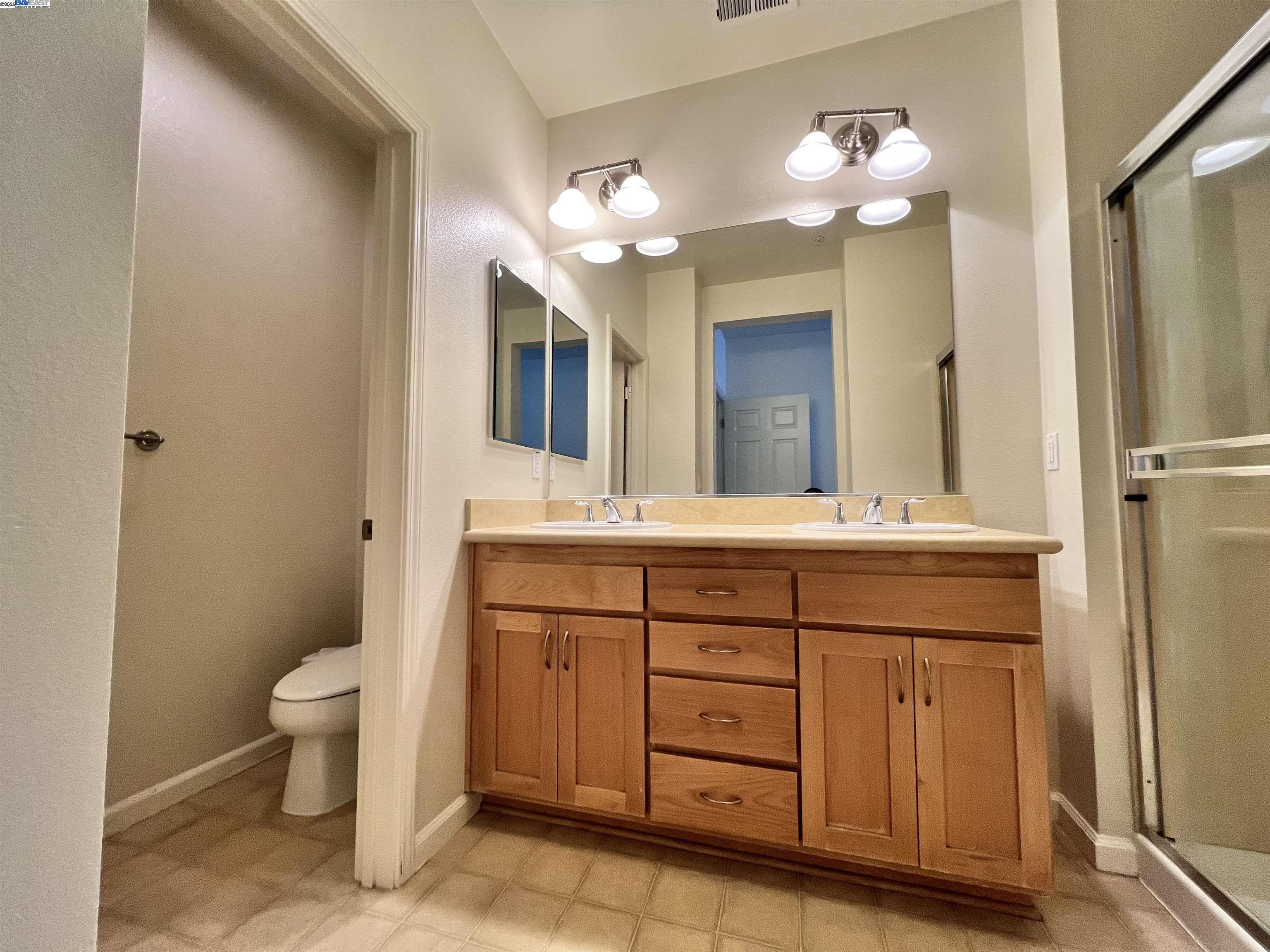 4331 Westerly Common Fremont, CA 94538 - Photo 20 of 24 a bathroom with a double vanity sink mirror and toilet