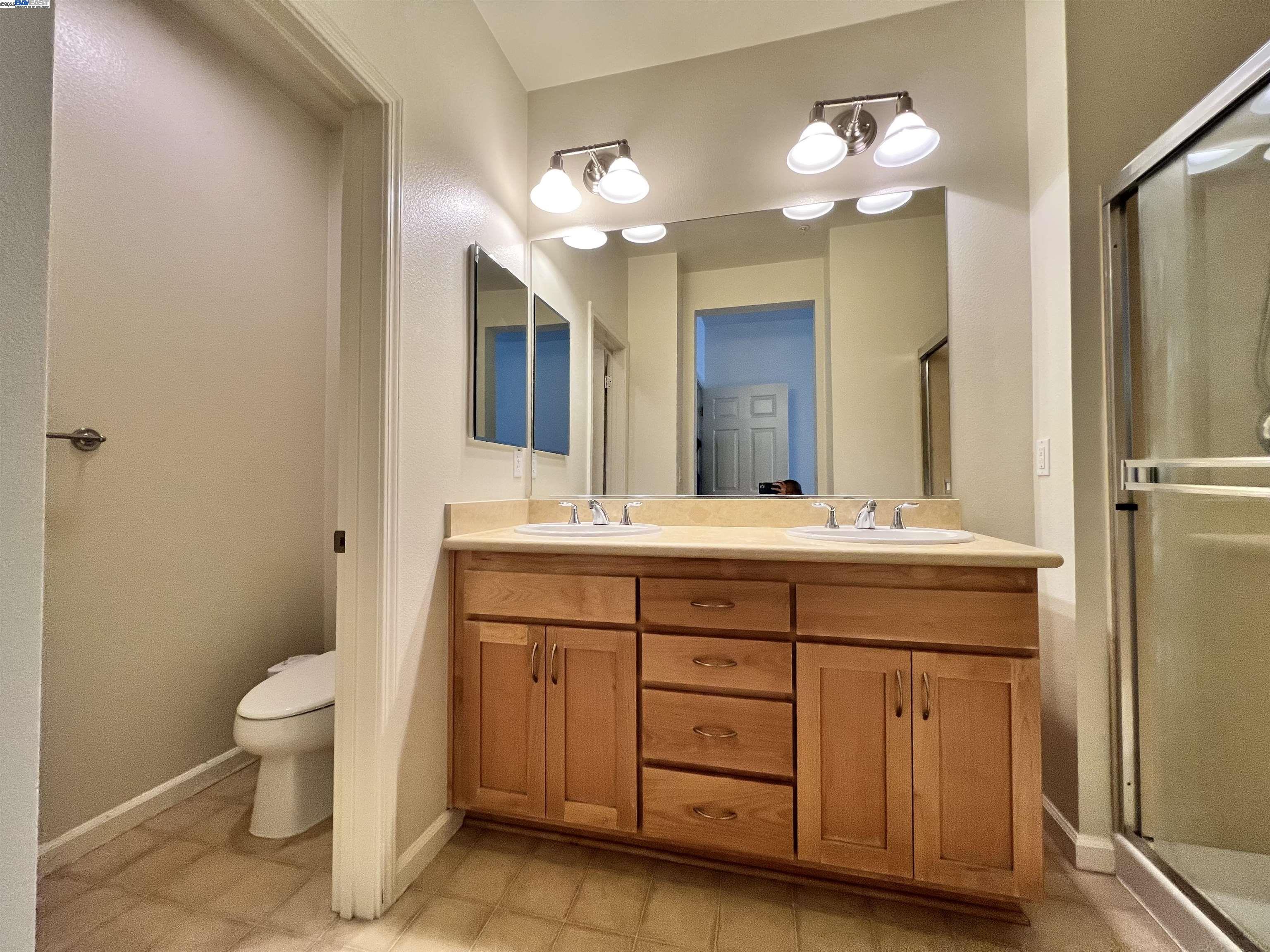 4331 Westerly Common Fremont, CA 94538 - Photo 21 of 24 a bathroom with a double vanity sink mirror and toilet