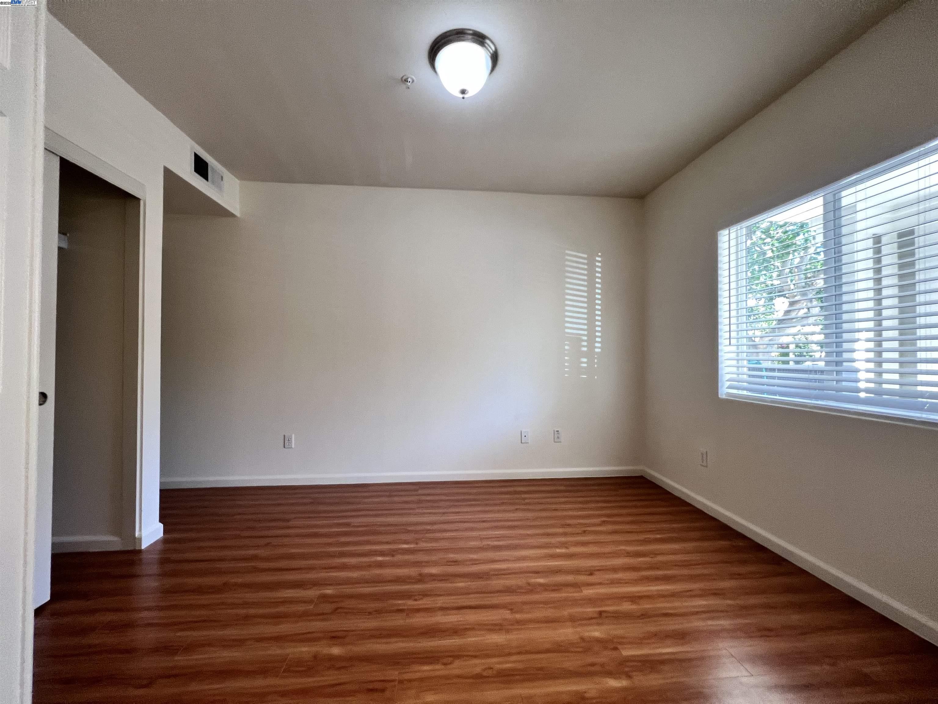 4331 Westerly Common Fremont, CA 94538 - Photo 22 of 24 wooden floor in an empty room with a window