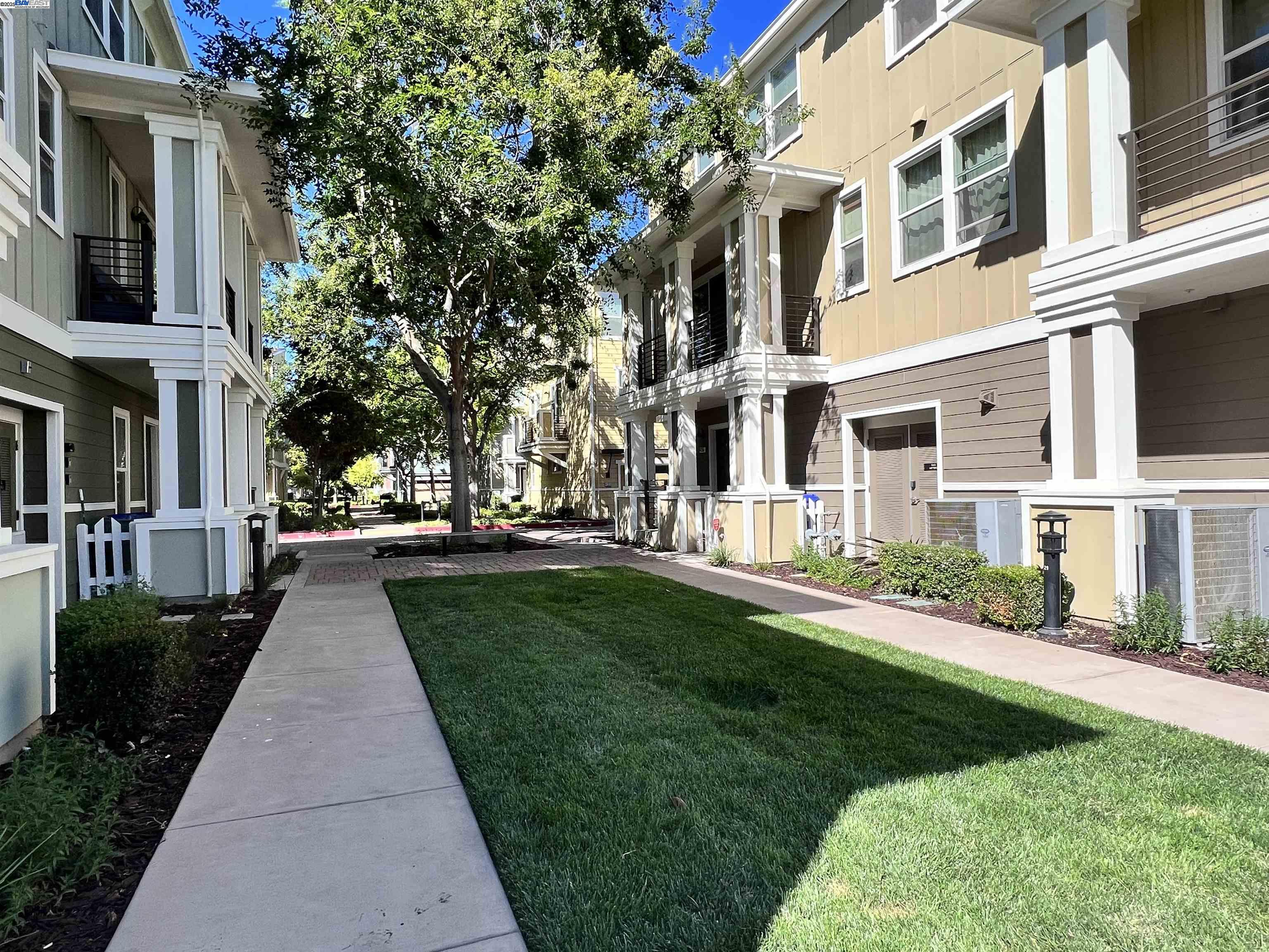 4331 Westerly Common Fremont, CA 94538 - Photo 3 of 24 front view of a brick house with a yard