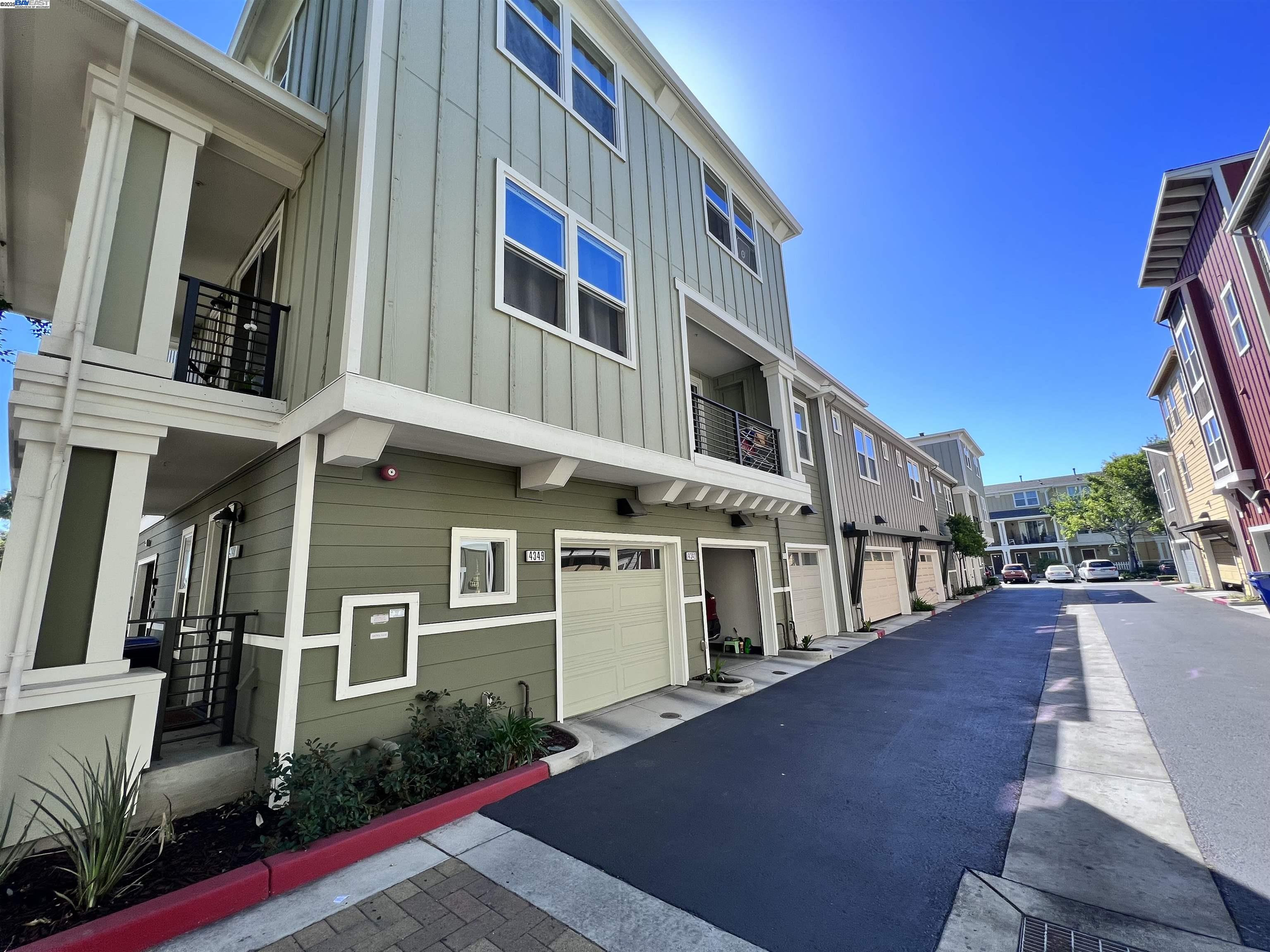 4331 Westerly Common Fremont, CA 94538 - Photo 4 of 24 a front view of a building with many windows