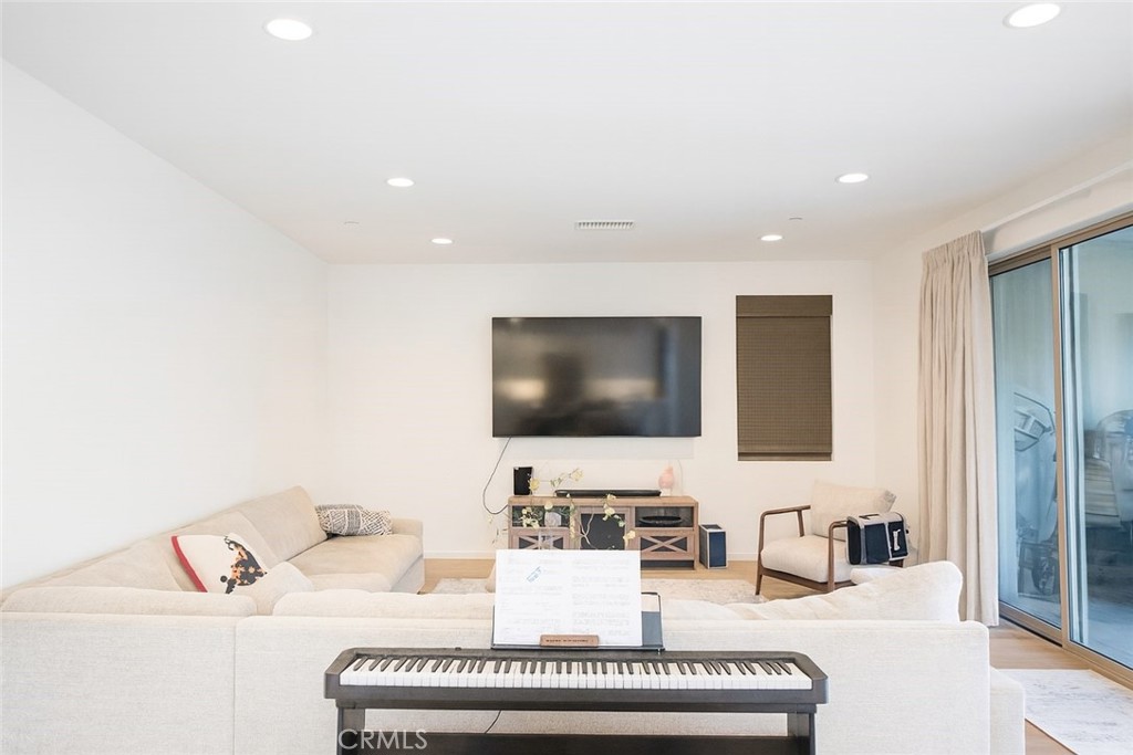 279 Barnes Road Tustin, CA 92782 - Photo 20 of 31 a living room with furniture and a flat screen tv