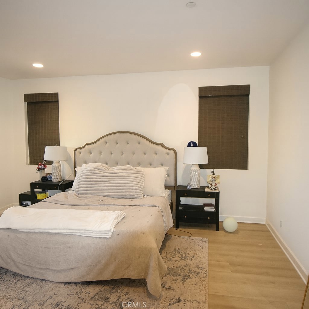 279 Barnes Road Tustin, CA 92782 - Photo 24 of 31 a bedroom with a bed and a table