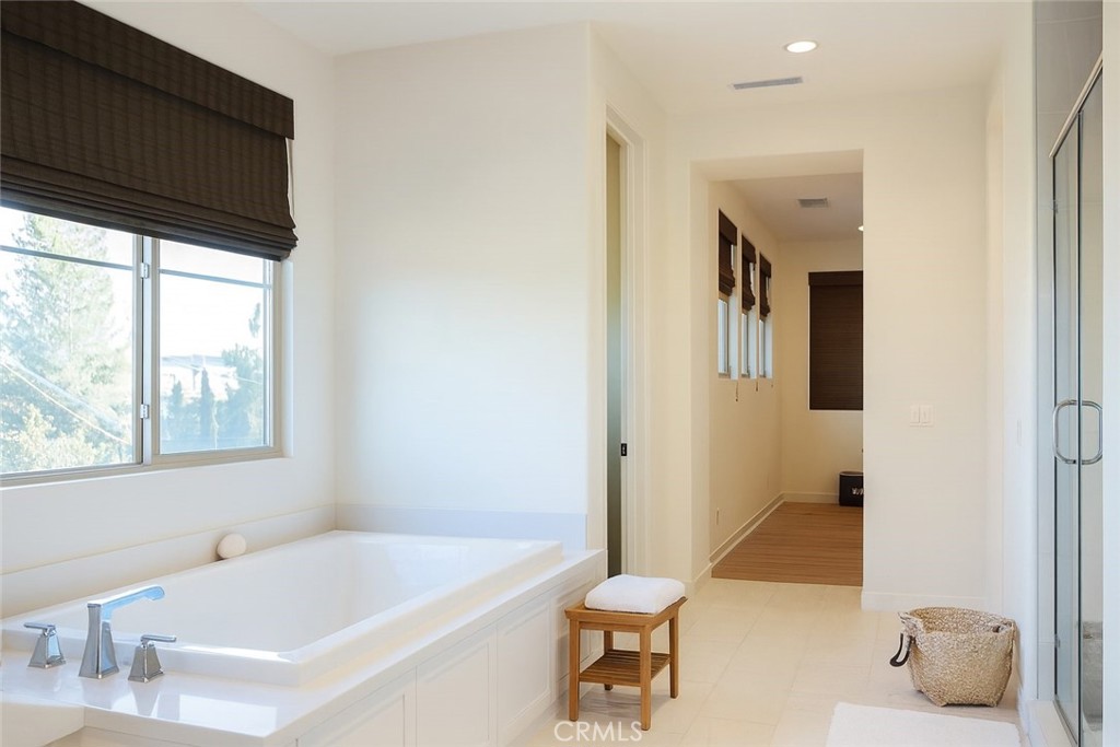 279 Barnes Road Tustin, CA 92782 - Photo 26 of 31 a bathroom with a tub a sink and a window