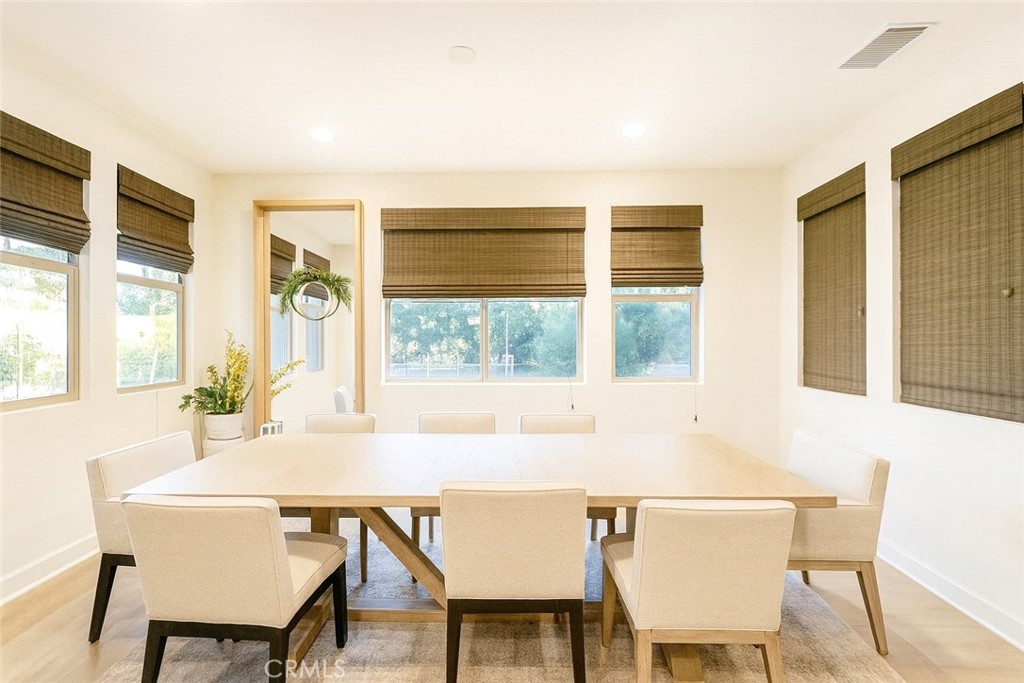 279 Barnes Road Tustin, CA 92782 - Photo 6 of 31 a view of a dining room with furniture and windows