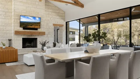 a living room with fireplace furniture and a flat screen tv