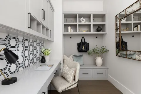 a living room with furniture and a potted plant