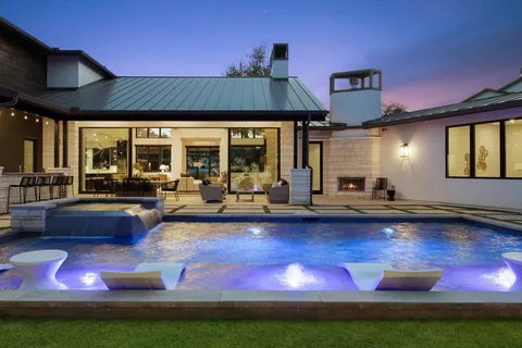 a view of swimming pool with outdoor seating