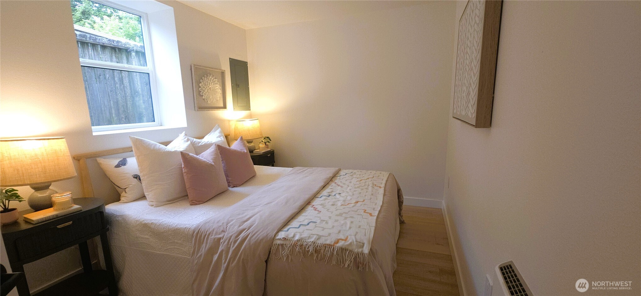 8421 39th Avenue Southwest Seattle, WA 98136 - Photo 20 of 24 a bedroom with a bed and a window