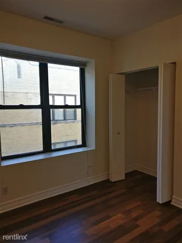 a view of a room that has a window in it