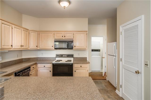 2033 Roderick Circle Franklin, TN 37064 - Photo 7 of 20 Another view of the kitchen shows the stack washer and dryer