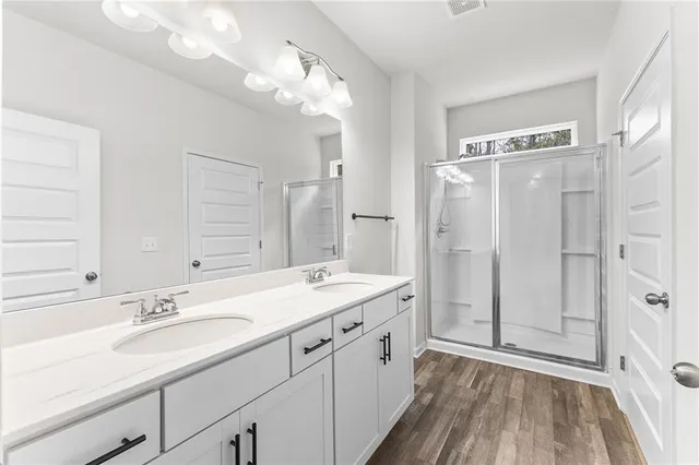 a bathroom with a sink double vanity and a mirror