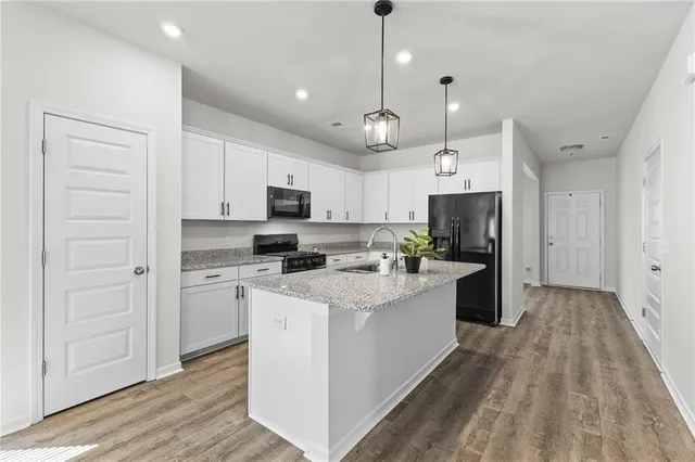 a large kitchen with cabinets
