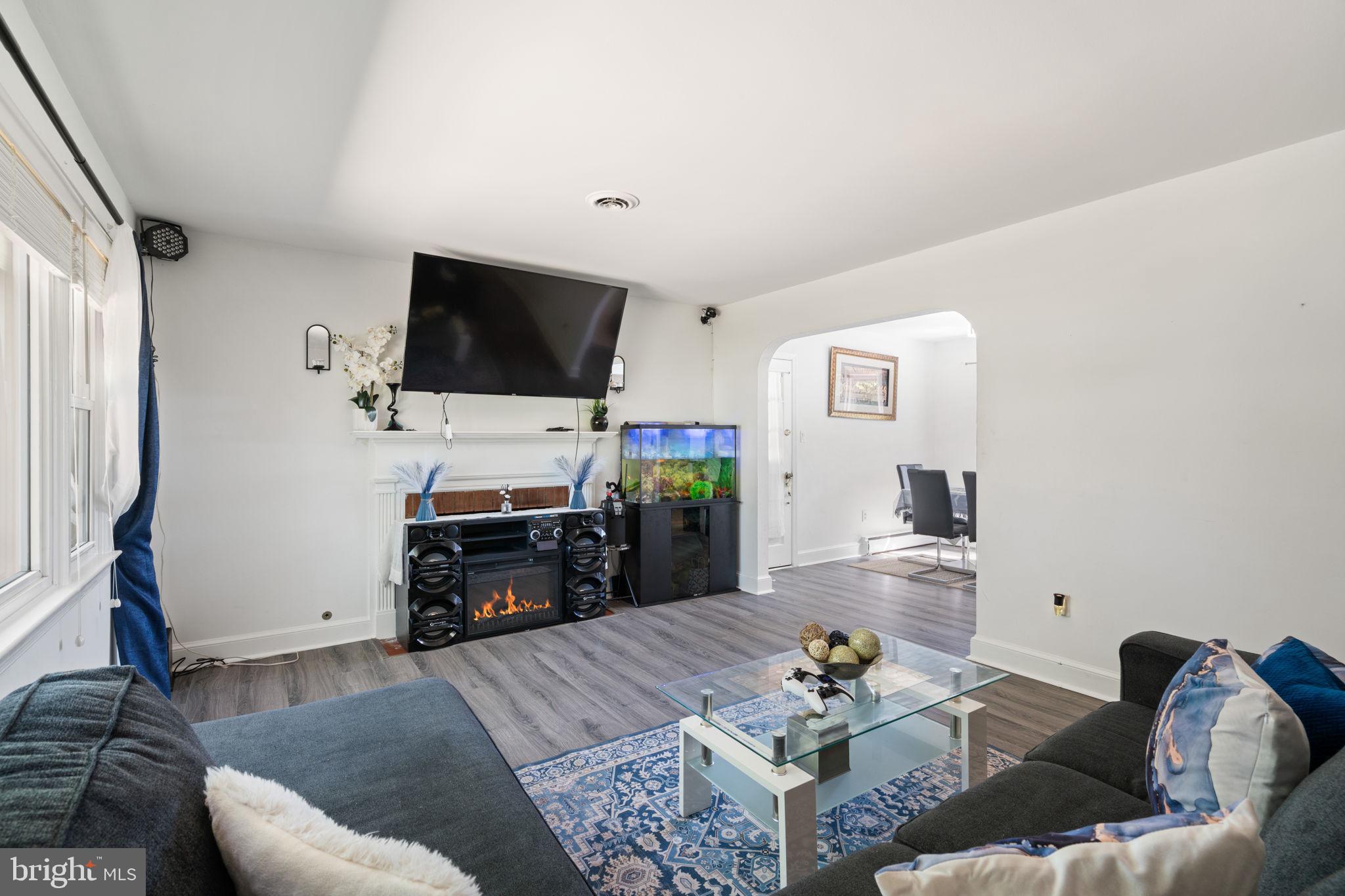 4921 Dumfries Road Catlett, VA 20119 - Photo 4 of 25 Warm Living Room with Wood-Burning Fireplace.
