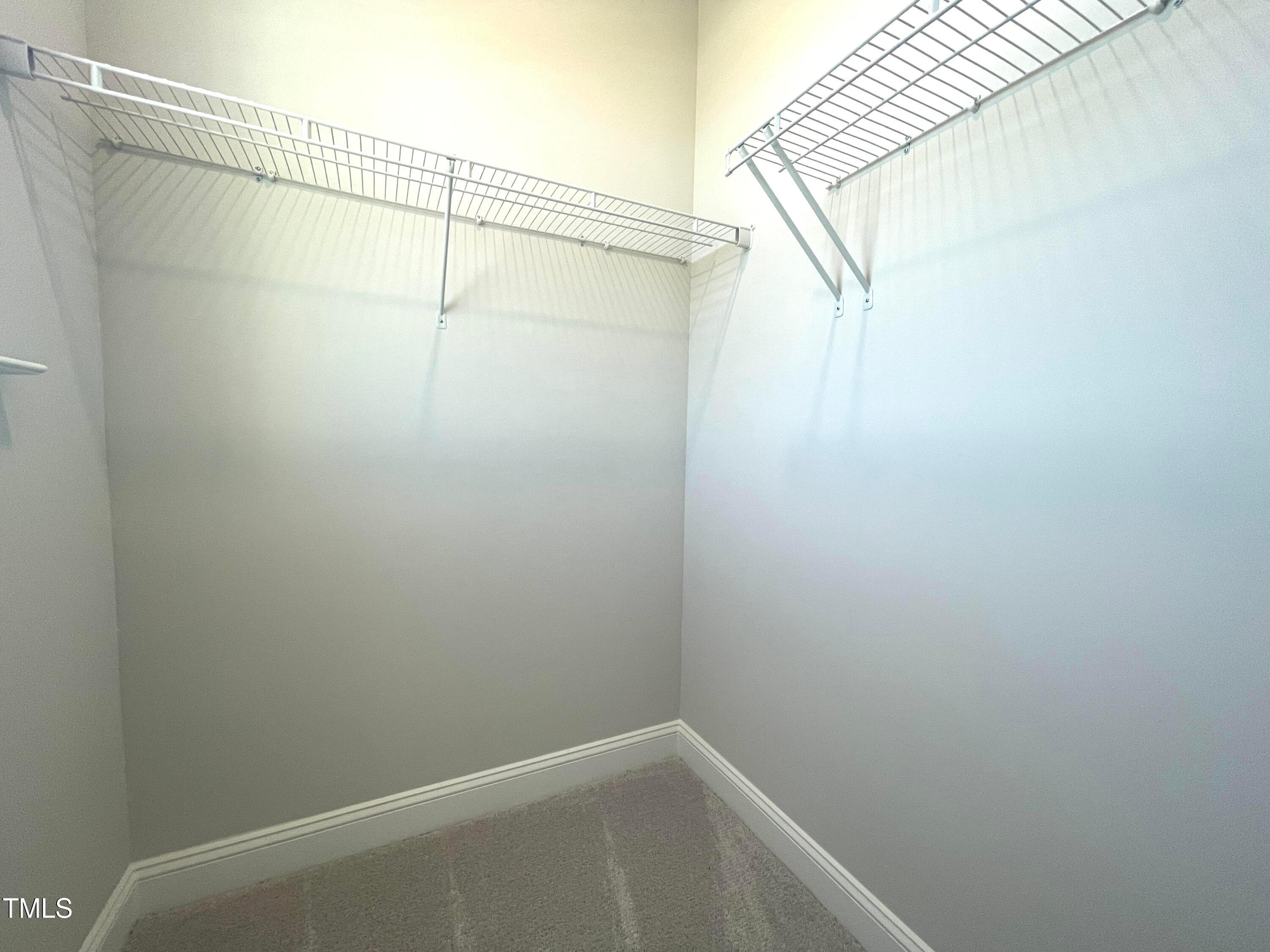 152 Baymouth Lane Raleigh, NC 27610 - Photo 14 of 25 a view of small space with racks on the wall