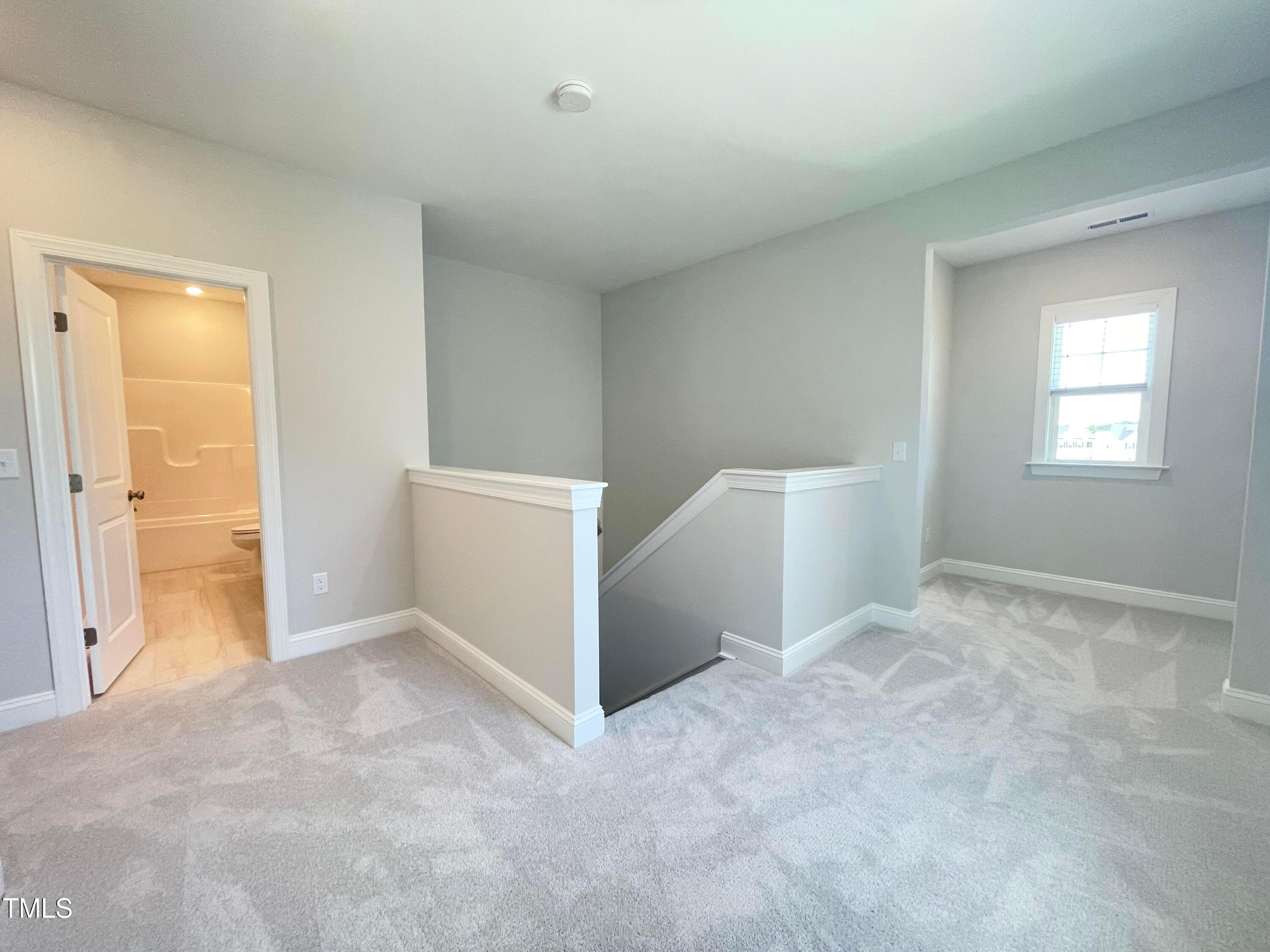 152 Baymouth Lane Raleigh, NC 27610 - Photo 18 of 25 a view of an empty room and window