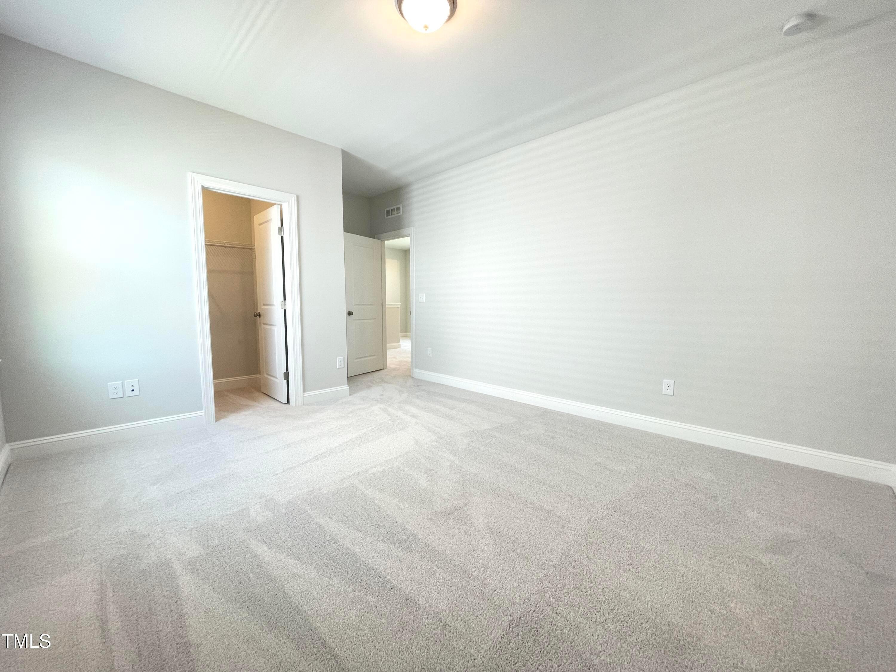 152 Baymouth Lane Raleigh, NC 27610 - Photo 22 of 25 a view of an empty room with a window