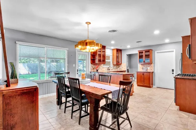 a view of a dining room with furniture window and outside view