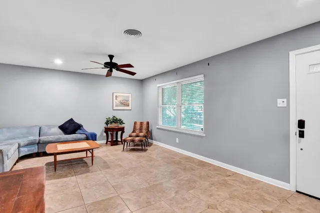 a living room with furniture and window