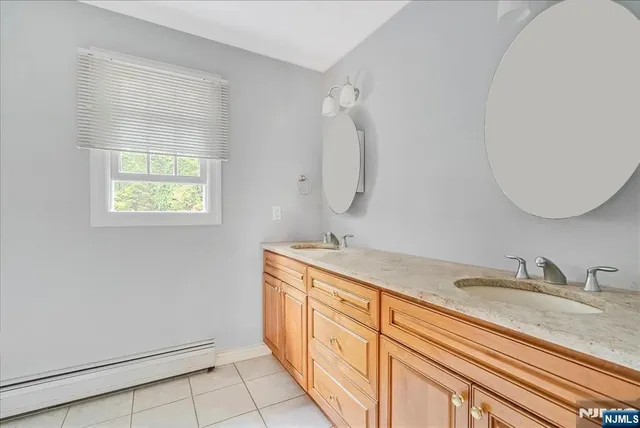 a bathroom with a sink a vanity and a mirror