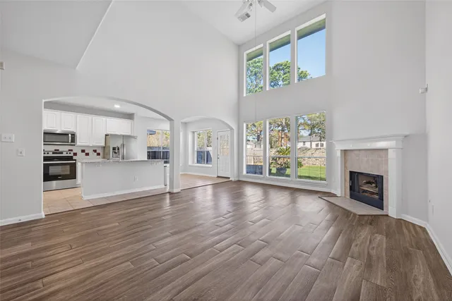 a kitchen with stainless steel appliances granite countertop a stove top oven a sink a counter space and cabinets
