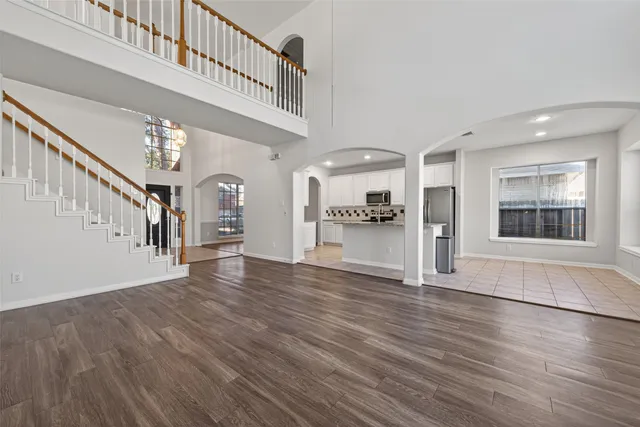 a view of an entryway with wooden floor