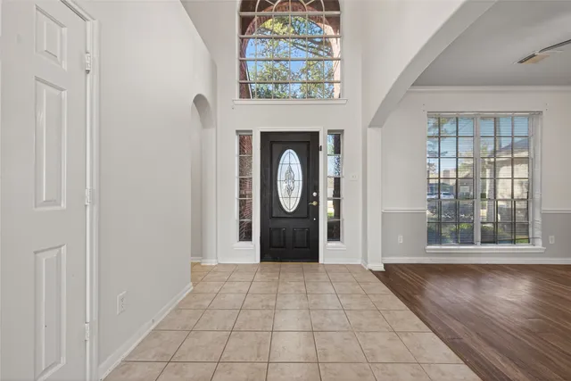 a kitchen with stainless steel appliances granite countertop a sink refrigerator and microwave