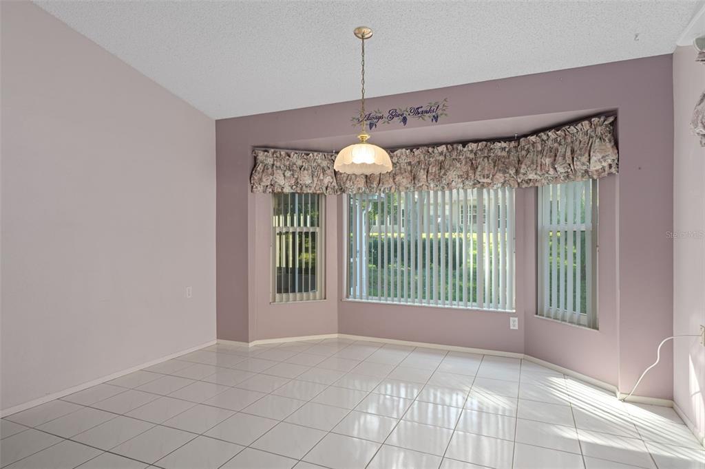 2321 Terrace View Lane Spring Hill, FL 34606 - Photo 15 of 41 a view of a room with a large window and chandelier