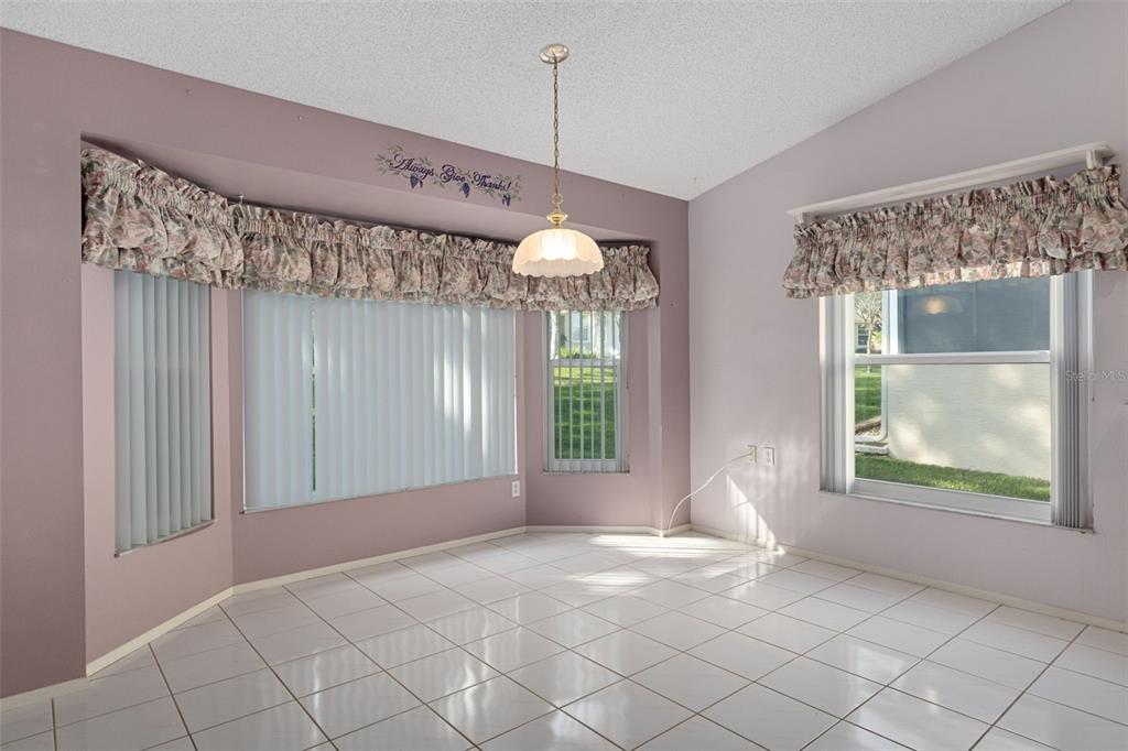 2321 Terrace View Lane Spring Hill, FL 34606 - Photo 16 of 41 a view of a room with a large window and chandelier