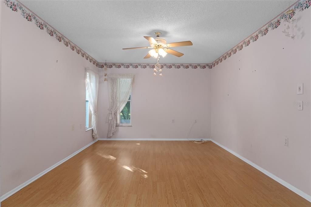 2321 Terrace View Lane Spring Hill, FL 34606 - Photo 24 of 41 a view of room with window and ceiling fan