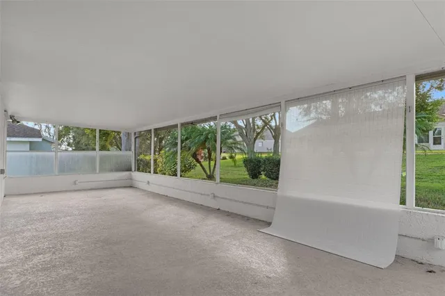 a view of a room with a large window