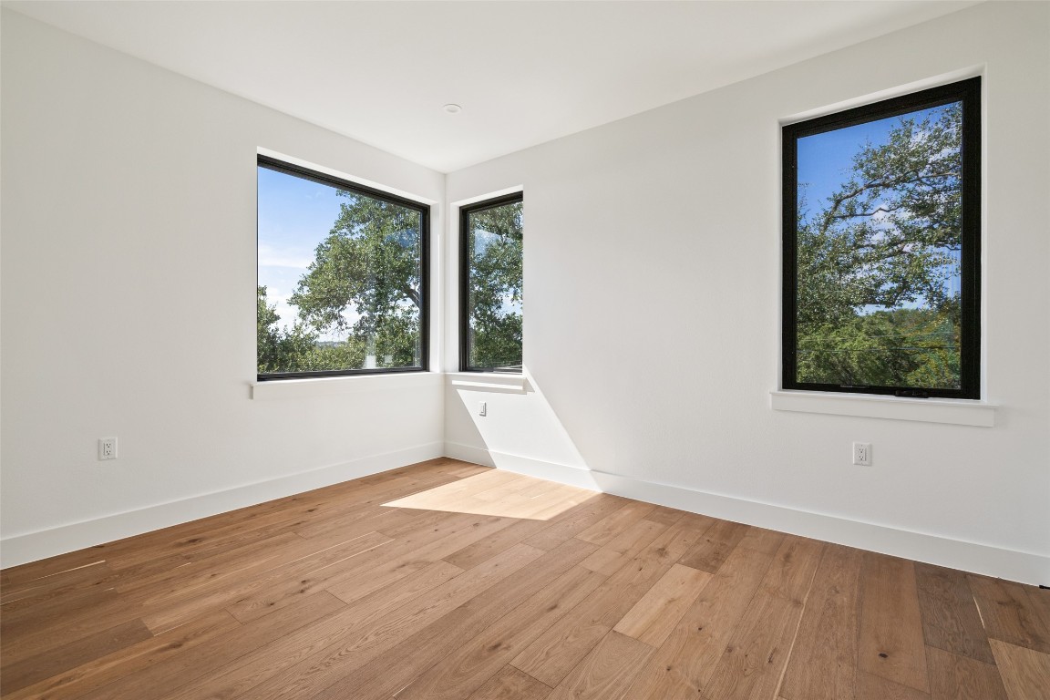 3208 Clawson Road, Unit 4A Austin, TX 78704 - Photo 23 of 28 a view of an empty room with wooden floor and a window