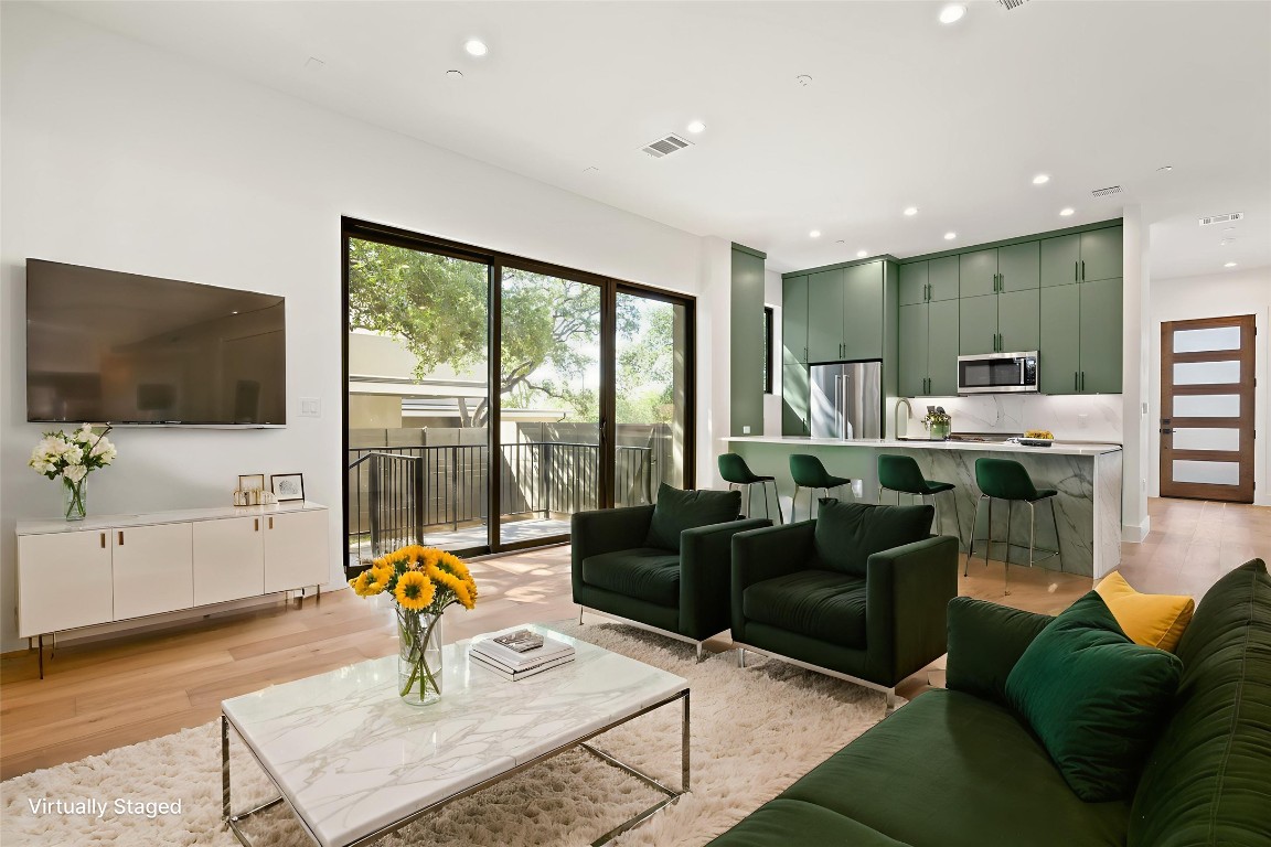 3208 Clawson Road, Unit 4A Austin, TX 78704 - Photo 8 of 28 a living room with furniture and a flat screen tv