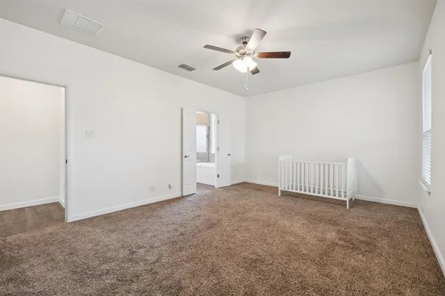 a bathroom with a sink a toilet a mirror and shower