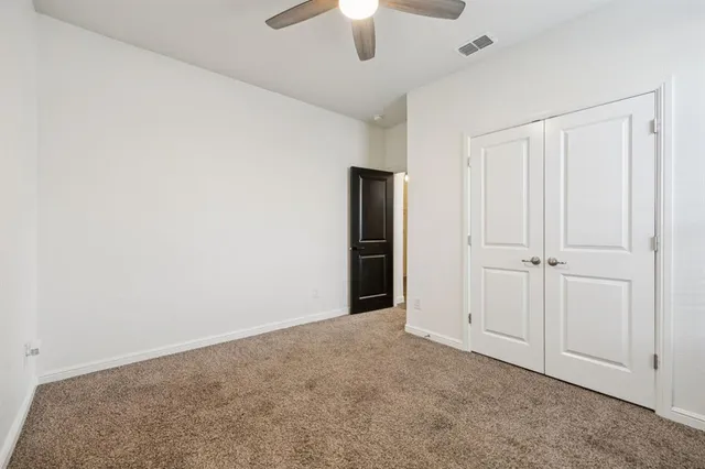 a kitchen with stainless steel appliances granite countertop a sink a stove and a wooden floor