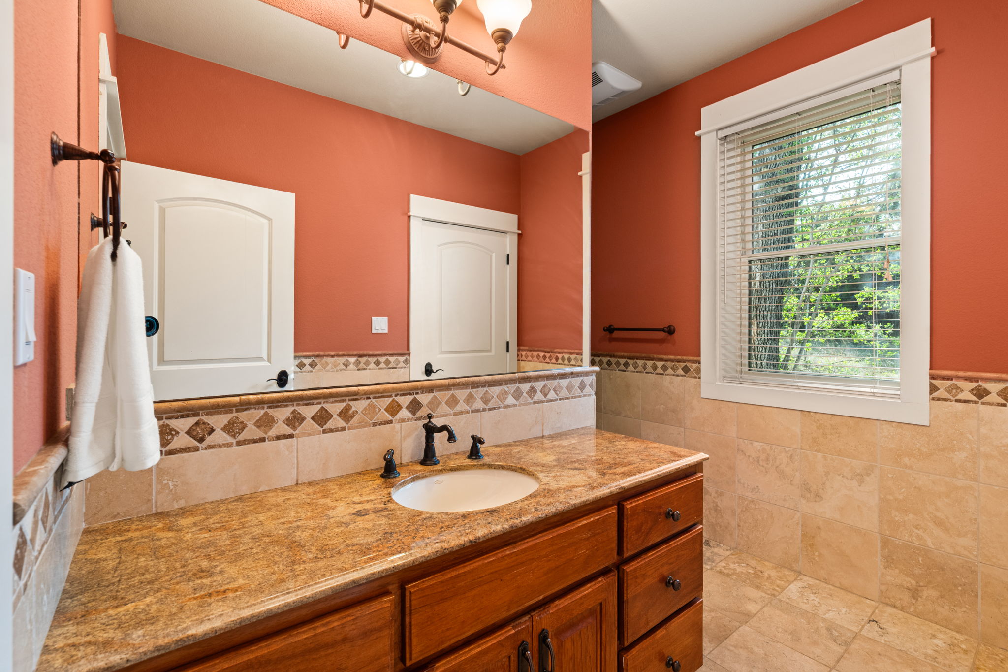 23426 Oscar Road Spicewood, TX 78669 - Photo 32 of 40 The bathroom in the guest house. There is a walk-in shower around the corner.