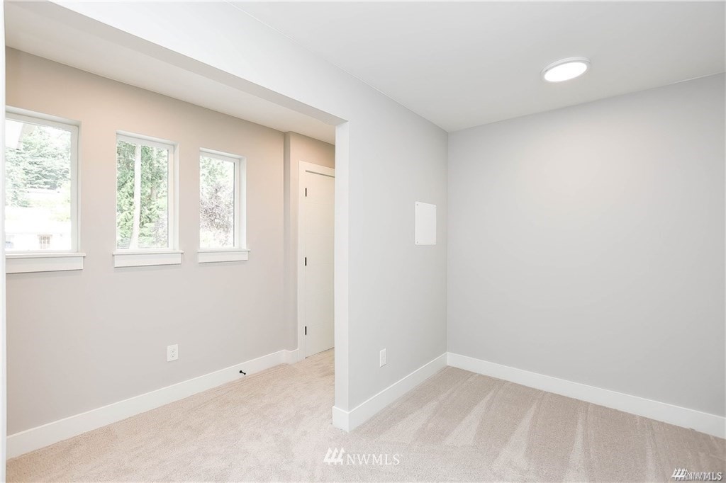 220 228th Street Southeast Bothell, WA 98021 - Photo 14 of 20 an empty room with windows