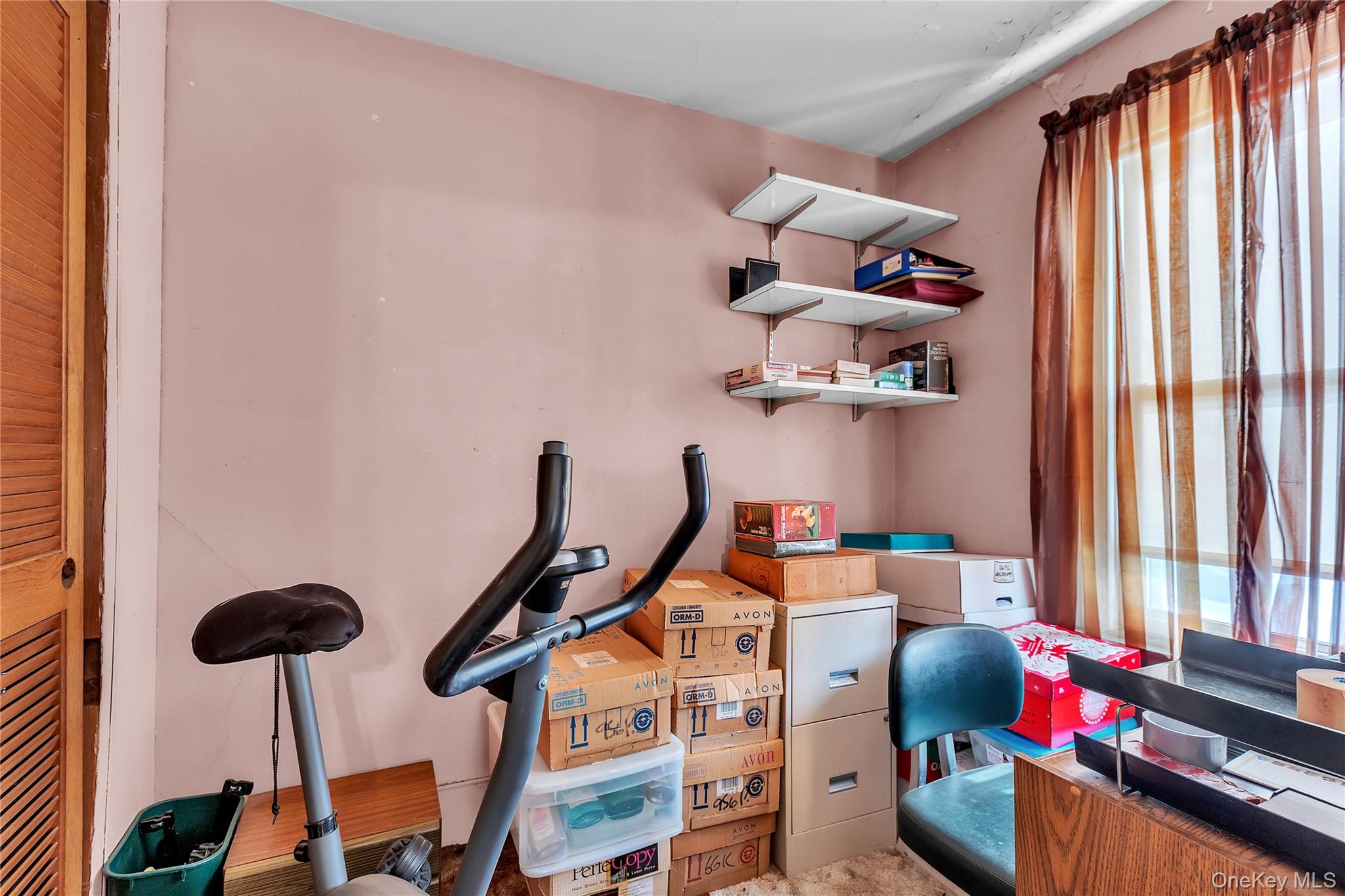 956 Paulding Street Peekskill, NY 10566 - Photo 16 of 27 a room with furniture and a window