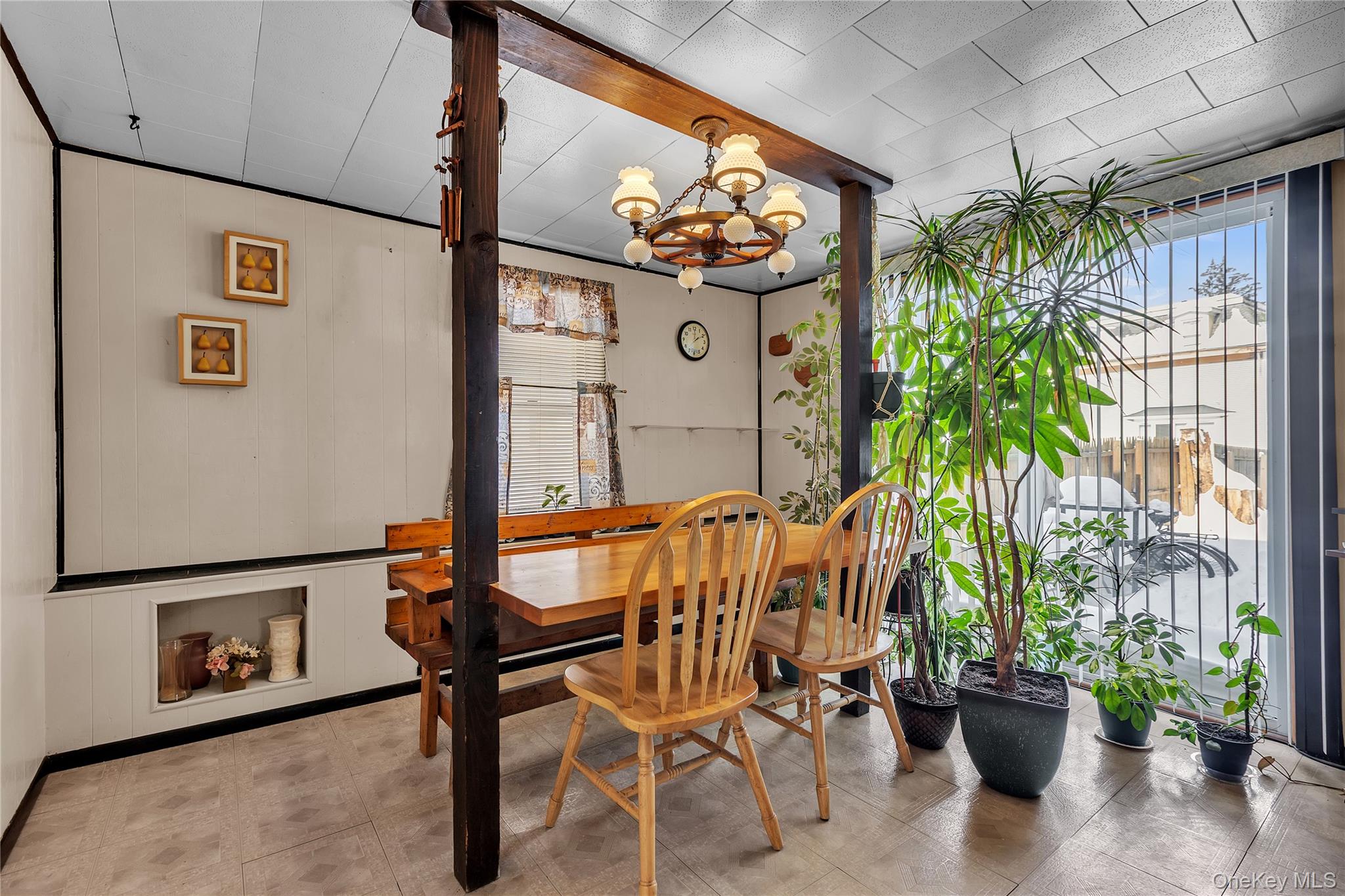 956 Paulding Street Peekskill, NY 10566 - Photo 9 of 27 a dining room with furniture and a potted plant