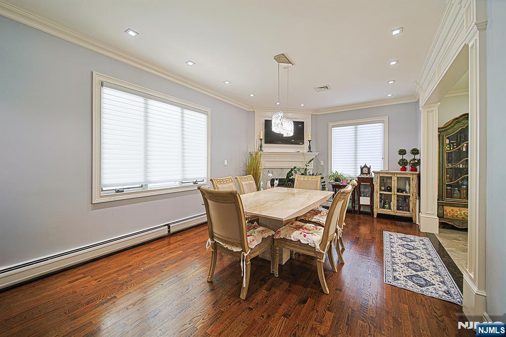 897 Virgil Avenue Ridgefield, NJ 07657 - Photo 21 of 50 a view of a dining room with furniture and wooden floor