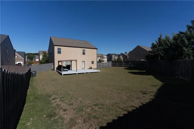 a house view with a backyard space
