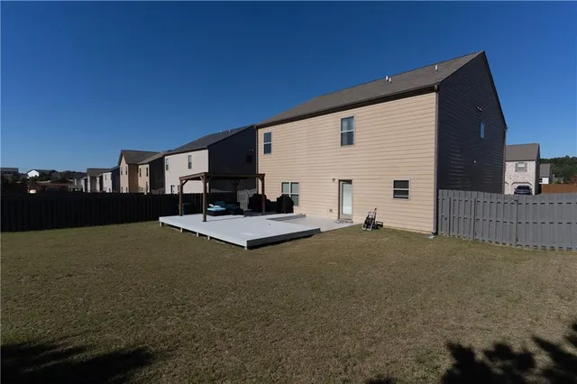 a view of living room kitchen and entryway