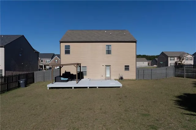 a spacious bathroom with a granite countertop sink and a mirror