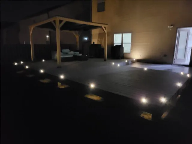 a view of a house with yard and sitting area