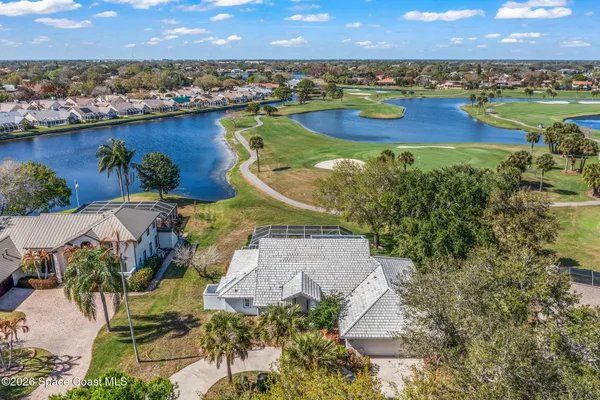an aerial view of a residential houses and outdoor space